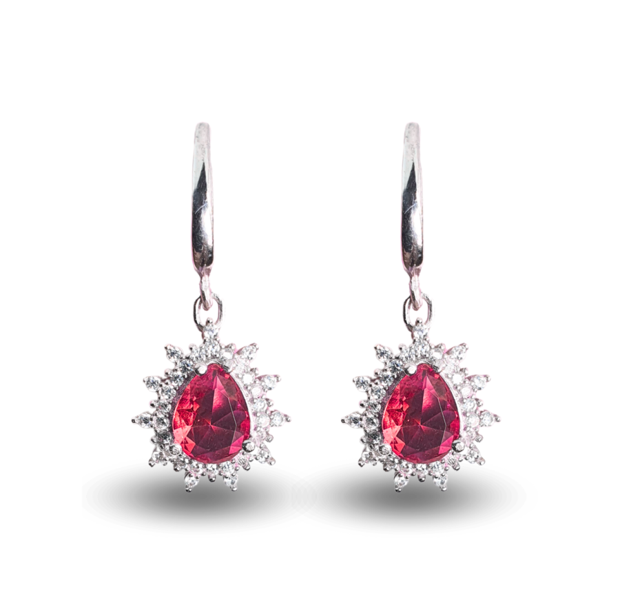 Earrings with teardrop-shaped Zultanite and a radiant zircon halo.