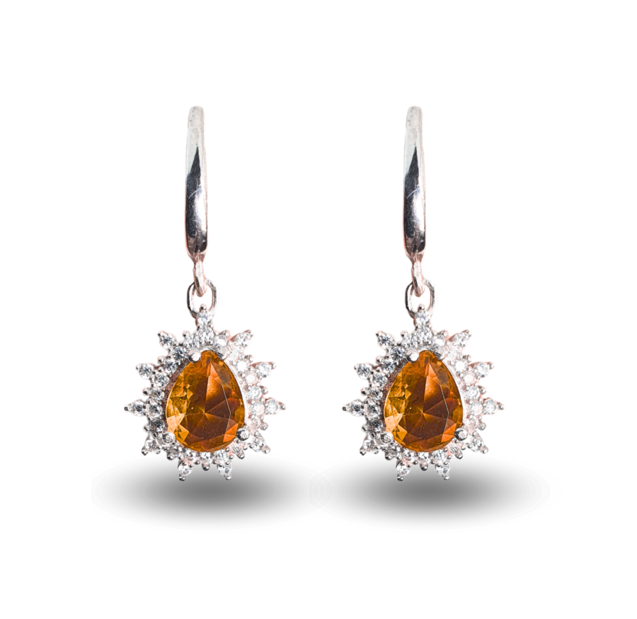 Earrings with teardrop-shaped Zultanite and a radiant zircon halo.