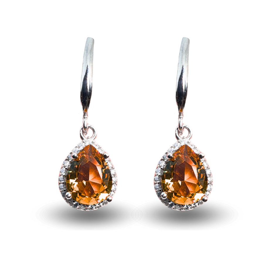 Earrings with teardrop-shaped Zultanite surrounded by a sparkling zircon frame.